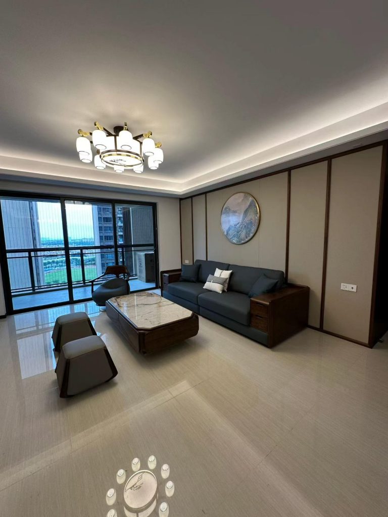 New Chinese-style living room with a custom walnut and teal-upholstered sofa, marble coffee table and circular landscape art