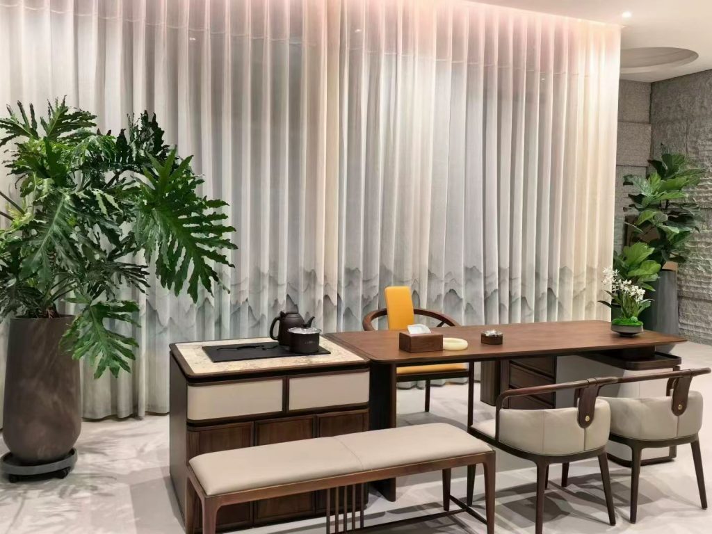 Whole-view custom walnut tea room with long bench seating beneath mountain-pattern sheer curtains